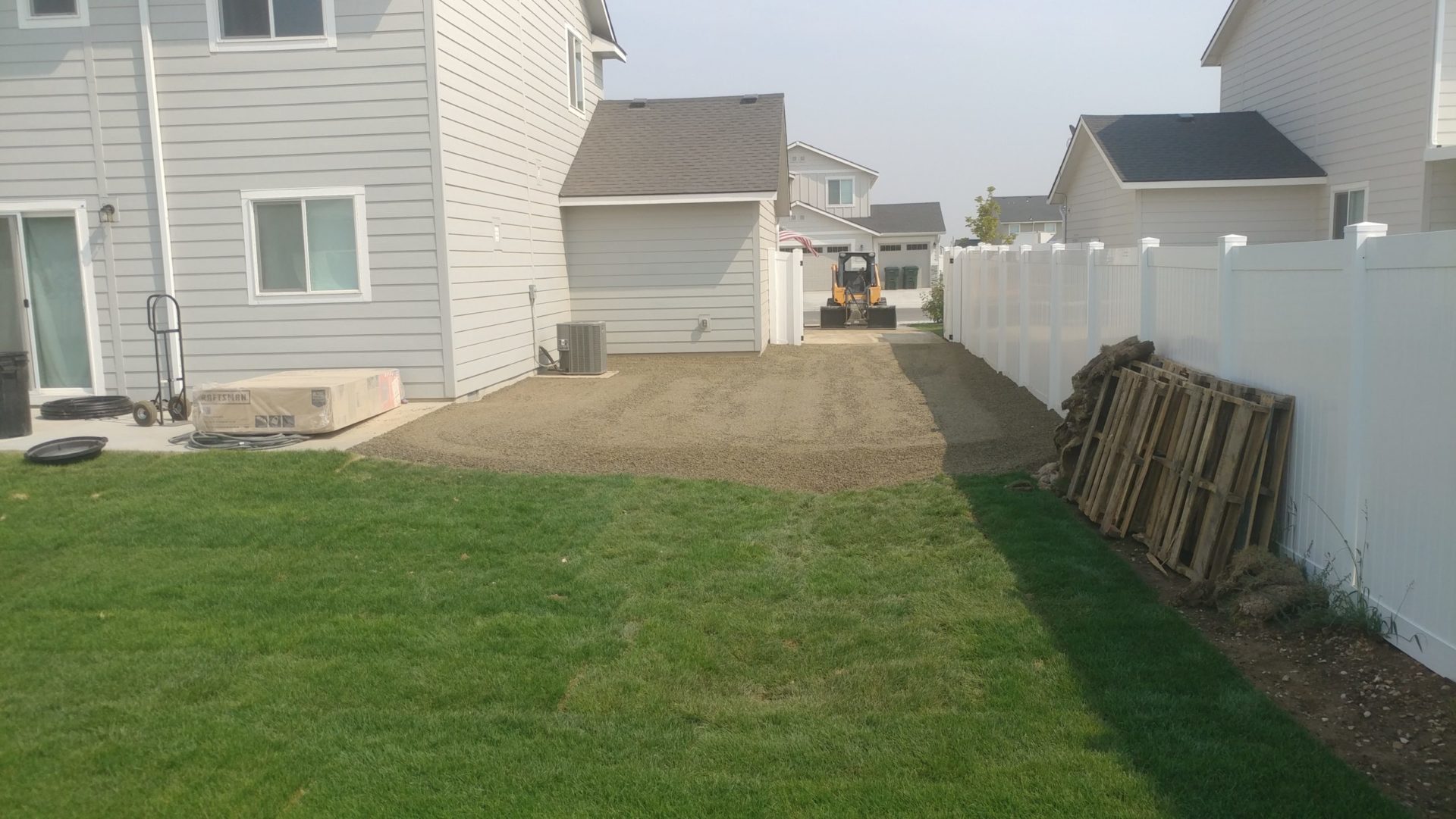 Completed Yard Grading with Lawn Drain and Gravel Driveway