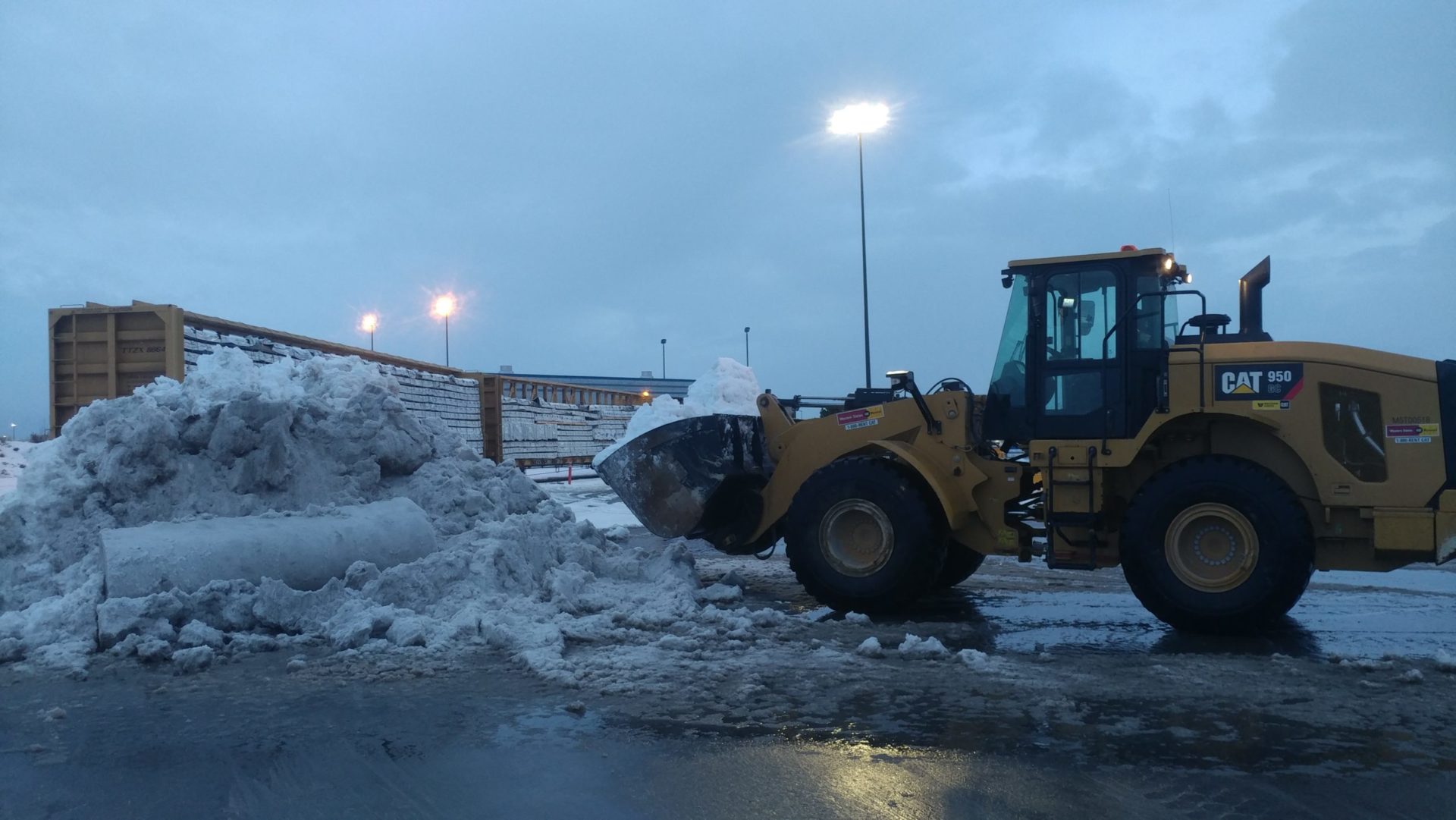Using a Loader to Pile Snow Out of the Way